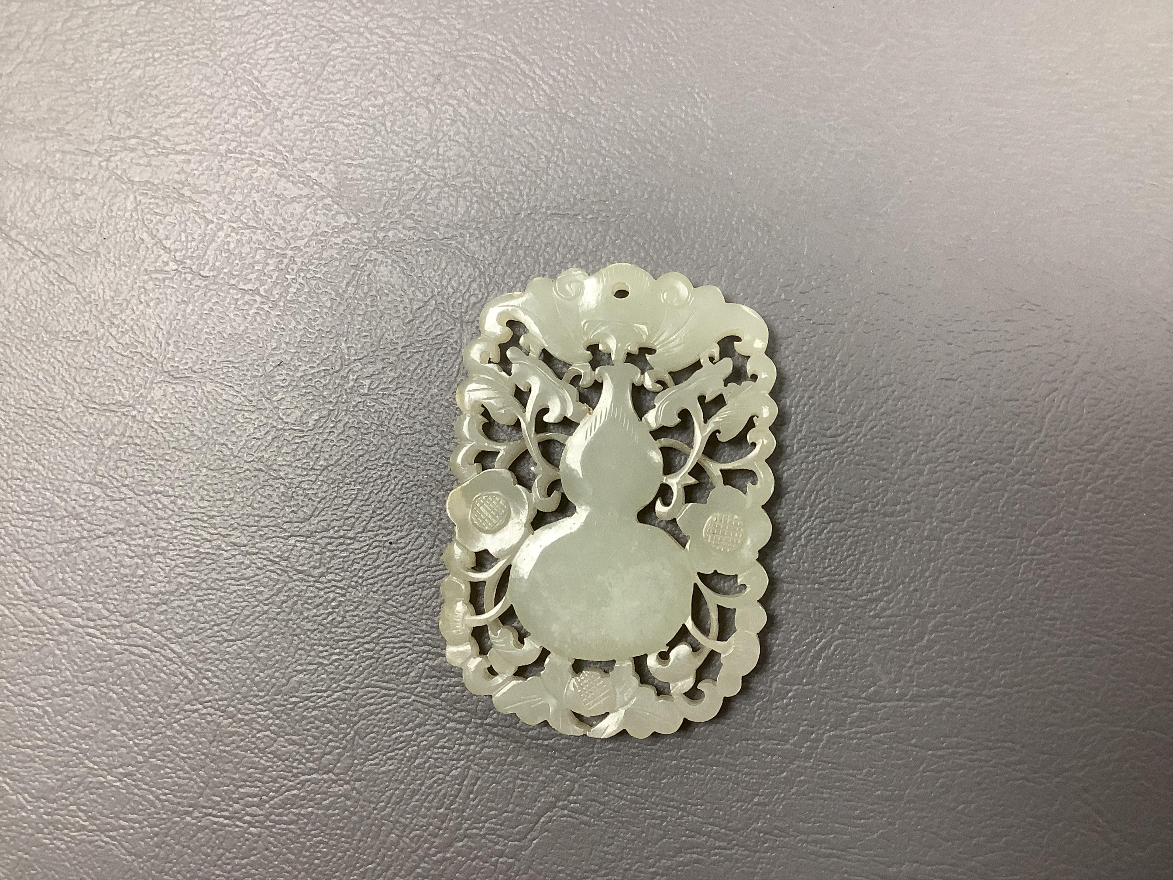 A carved jade/nephrite 19th century carving, 6cm long. Condition - good